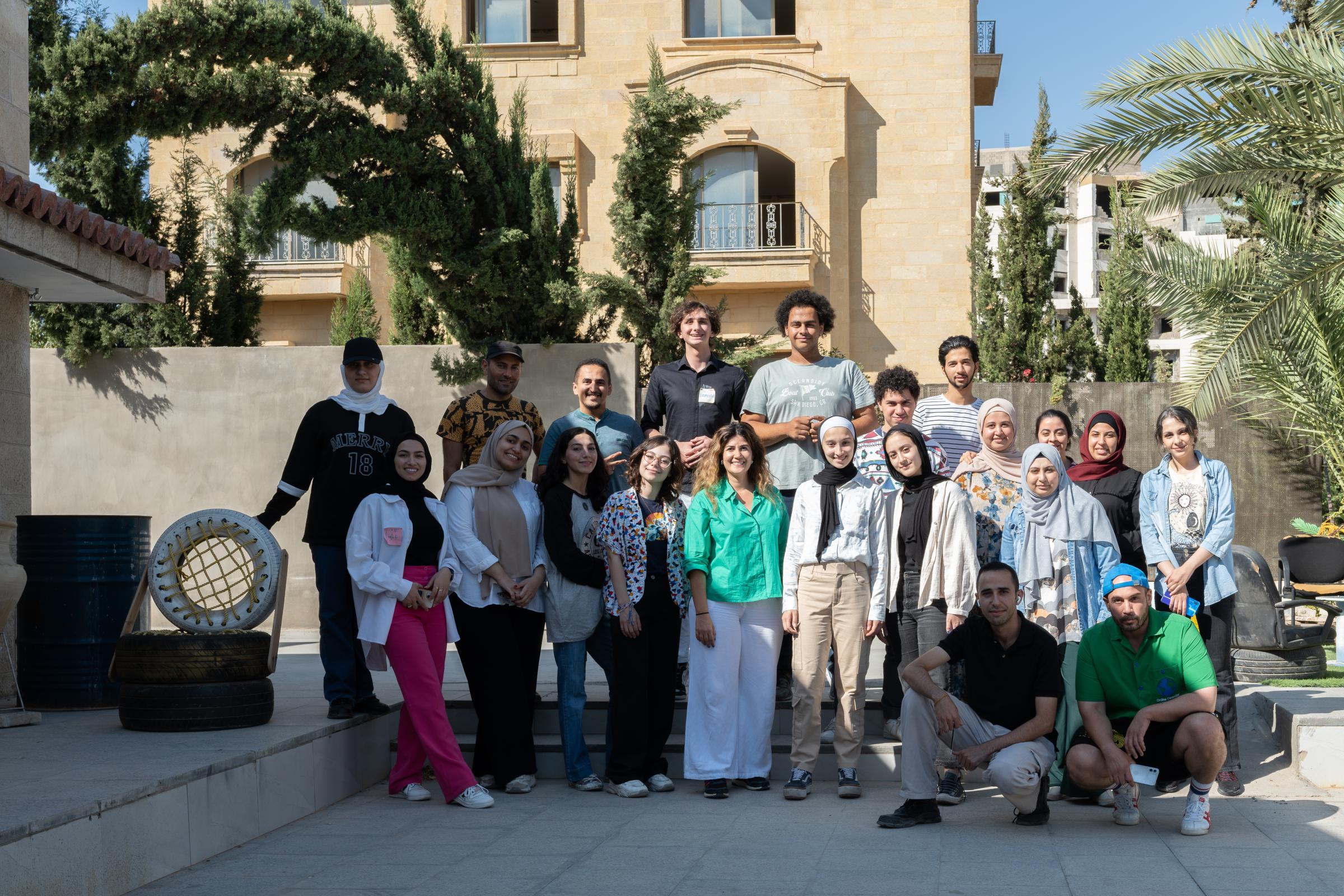 Creative Impact Lab Amman participants standing together outdoors.
