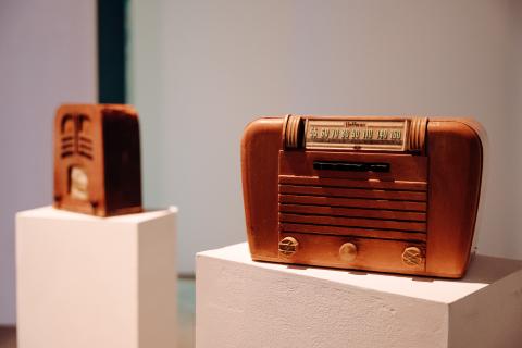 Two Old vintage radios on pedastals.