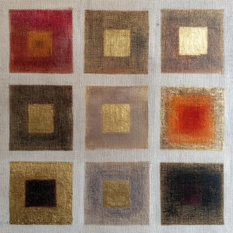 A grid of nine textured squares painted on a neutral linen background. Each square contains a luminous gold or warm-toned center surrounded by layers of muted color—reds, browns, greys, and ochres. The metallic gold surfaces catch light, evoking both sacred icons and woven textiles, balancing geometry and radiance.
