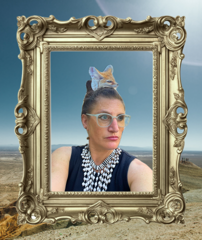 A digital portrait of artist Tanya Vlach set inside an ornate gold frame against a desert landscape. She wears translucent glasses, a sleeveless black top, and a layered white beaded necklace. A small fox’s head emerges from her hair, symbolizing transformation and hybrid identity. The lighting is warm and surreal, evoking mythic energy and desert clarity.