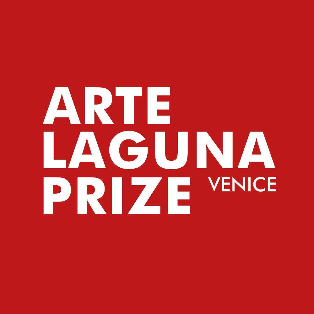 Graphic image with red background and white text that reads "Arte Laguna Prize Venice"